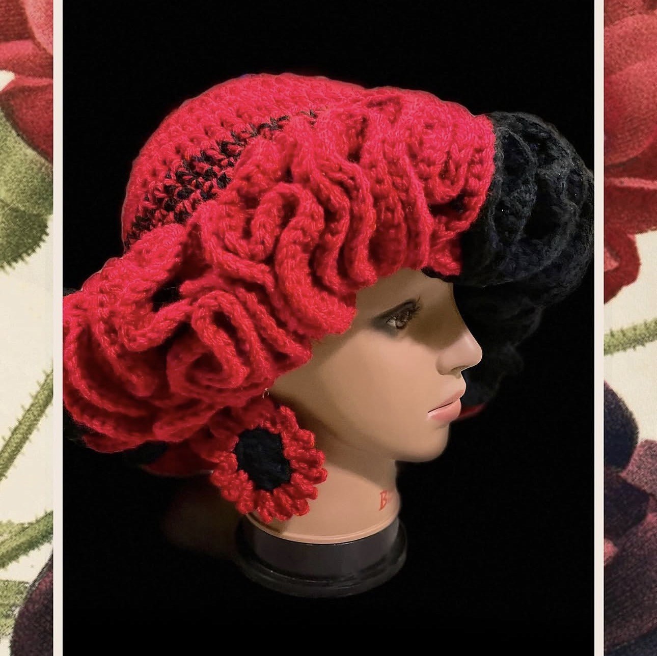Red and black sculptural crochet hat with matching flower earrings